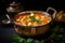 paneer butter masala curry in a copper bowl