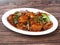 Paneer chilli is Indo Chinese cuisine dish, Paneer cubes tossed with tomatoes, onions, spring onions, chilli sauce. served over a
