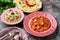 Paneer Makhani, Jeera Rice and paratha in pink plate on dark background