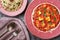 Paneer Makhani, Jeera Rice and paratha in pink plate on dark background