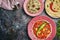 Paneer Makhani, Jeera Rice and paratha in pink plate on dark background