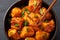 Paneer Manchurian or Paneer 65 in bowl at black slate background. Close up