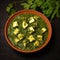 Paneer pieces with rich green gravy of Methi on bowl generative AI