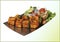 Paneer Tikka or chilli paneer Kabab - Tandoori Indian cheese skewers, served in white plate with colourful capsicum and onion