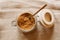 Panela sugar background. Close up view of raw cane sugar in a jar.