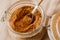 Panela sugar background. Close up view of raw cane sugar in a jar.