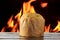 Panettone, decorative food, on wooden table, fire in the background