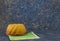 Panettone, easter bread on dark stone table with green linen napkins