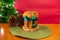 Panettone with green ribbon and red Christmas background