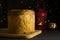 Panettone on the wooden board. Traditional italian christmas cake with lantern with candle