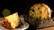 Panettone on wooden table, background with flashing bokeh lights