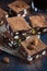 Panforte nero squares . Traditional italian cake with nuts and