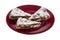 Panforte slices on red plate, isolated on white. Italian Christmas sweet dessert, cake make with dried fruits and nuts.