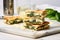 panini sandwich with spinach and cheese on a marble table