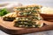 panini sandwich with spinach and cheese on a marble table