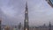 Paniramic skyline view of Dubai downtown with mall, fountains and Burj Khalifa aerial day to night timelapse