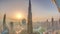 Paniramic skyline view of Dubai downtown during sunrise with mall, fountains and Burj Khalifa aerial morning timelapse