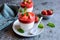 Panna cotta with strawberry sauce topping, served in a glass jar