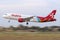 Panned shot of an Air Malta Airbus landing