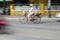 Panned shot showing a woman cycling in vietnam