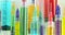 Panning across rows of bright colorful syringes