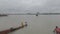 Panning camera horizontally. Landscape view form Vidyasagar Setu or Second Hooghly Bridge to Howrah Bridge, on a rainy day.