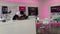 Panning down on a T Mobile employee helping a customer on the phone at a T Mobile Store in Orlando, Florida