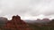 Panning drone shot of Red Rock Formations On A Rainy Day In Sedona, Arizona