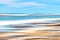 Panning effect or intentional movement of ICM camera on a beach during a sunny day