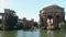 panning footage of a beautiful spring landscape at Palace of Fine Arts with a lake, lush green trees and plants