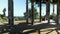 panning footage of the Glass-Simons memorial sculpture at Angels Point at Elysian Park with lush green trees, skyscrapers