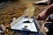 Panning for gold with a sluice box