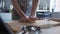 Panning medium wide, Woman kneading fresh dough at home in her kitchen, slow motion