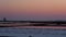 Panning on salt ponds near Trapani in Sicily at sunset.