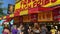 Panning shot of the Fresh French Fries food vendor at the Minnesota State Fair, surrounded by crowds of people