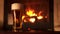 Panning shot full glass of appetizing cooled refreshment beer with foam surrounded by fireplace