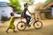 panning shot of a girl riding bicycle