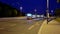 PANNING SHOT of a tram as it travels up a hill in Prague at night