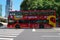 Panning of a sightseeing doubledecker just departed from the bus stop near People`s square in S