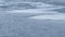 Panning. Timelapse of water waves on partly frozen lake