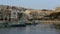 The panning of traditional Maltese boats in sunset