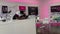 Panning up on a T Mobile employee helping a customer on the phone at a T Mobile Store in Orlando, Florida
