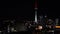 Panning view of Auckland financial center skyline CBD with the Sky Tower at night