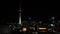 Panning view of Auckland financial center skyline CBD with the Sky Tower at night