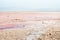 Panning view close up salt mineral particles macro on Tuz salt lake in Turkey . Tuz golu panorama with horizon in sunny summer day