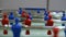 Panning view of - foosball, table soccer. Team sport, table football players. Competitive table game