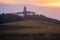 Pannonhalma Archabbey with wheat field on sunset time