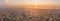 Pano aerial drone shot of Barcelona city with sunrise over horizon