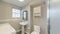 Pano Bathroom and laundry room with shower stall and wall cabinets