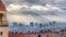 Pano Bell tower and red rooftop of a church against foggy Salt Lake City landscape